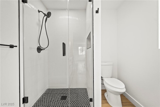 full bathroom with toilet and a stall shower