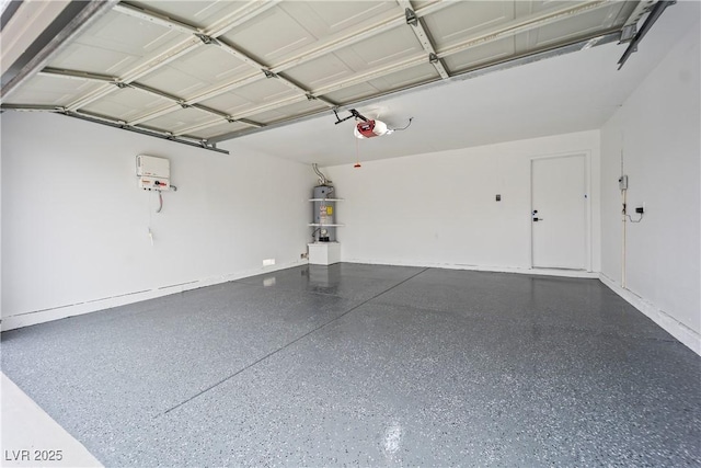 garage with water heater and a garage door opener