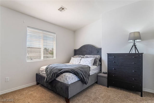 bedroom with baseboards, carpet flooring, and visible vents