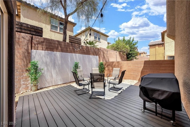 deck featuring fence and area for grilling