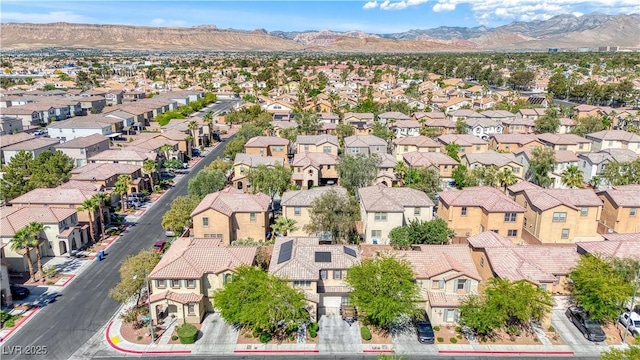birds eye view of property featuring a mountain view and a residential view