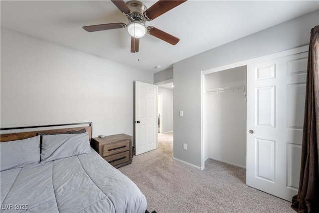 bedroom with baseboards, carpet floors, a ceiling fan, and a closet