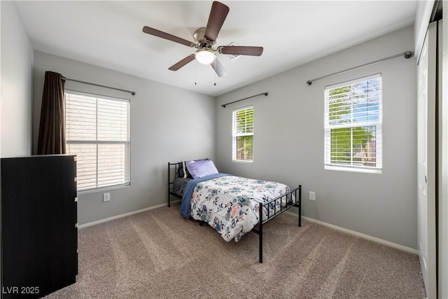 bedroom featuring baseboards, a ceiling fan, and carpet floors
