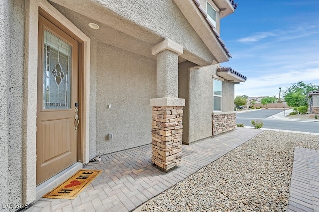 2486 Dragon Fire Ln, Henderson, NV 89052 - entrance to property with stucco siding and stone siding