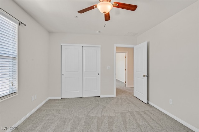 2486 Dragon Fire Ln, Henderson, NV 89052 - unfurnished bedroom featuring carpet, a closet, multiple windows, and baseboards
