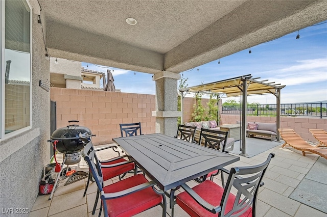 2486 Dragon Fire Ln, Henderson, NV 89052 - view of patio featuring a fenced backyard, an outdoor hangout area, area for grilling, and outdoor dining area