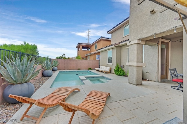 2486 Dragon Fire Ln, Henderson, NV 89052 - view of pool with a patio area, an in ground hot tub, a fenced in pool, and a fenced backyard