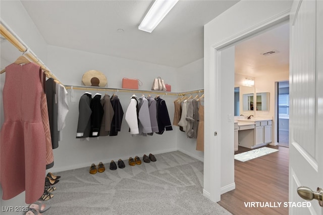 2486 Dragon Fire Ln, Henderson, NV 89052 - spacious closet featuring carpet floors and a sink