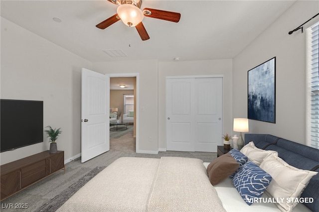 2486 Dragon Fire Ln, Henderson, NV 89052 - bedroom with carpet flooring, a closet, ceiling fan, and baseboards