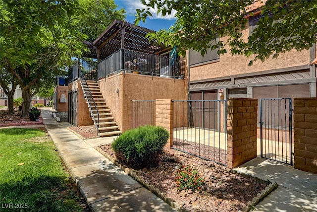 exterior space with stairway and fence private yard