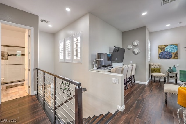 409 Lake Windemere St, Las Vegas, NV 89138 - hallway with baseboards, an upstairs landing, visible vents, and wood finished floors