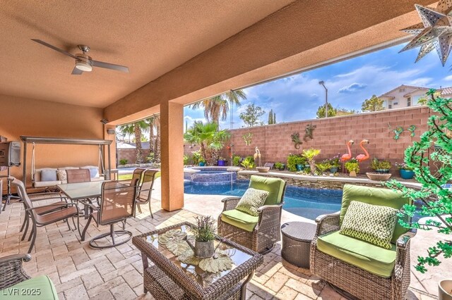 409 Lake Windemere St, Las Vegas, NV 89138 - view of patio with a ceiling fan, a pool with connected hot tub, an outdoor living space, and a fenced backyard
