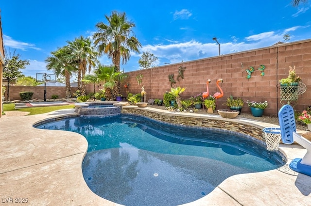 409 Lake Windemere St, Las Vegas, NV 89138 - view of swimming pool with a pool with connected hot tub and a fenced backyard