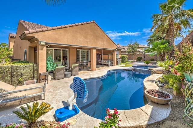 409 Lake Windemere St, Las Vegas, NV 89138 - view of swimming pool featuring a patio area, a pool with connected hot tub, and a fenced backyard