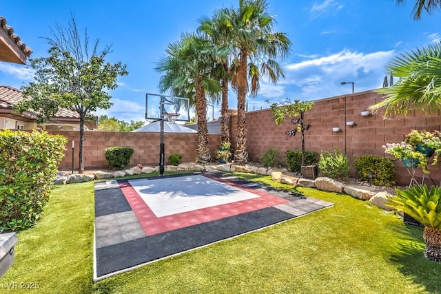 409 Lake Windemere St, Las Vegas, NV 89138 - view of basketball court with a fenced backyard, basketball court, and a yard