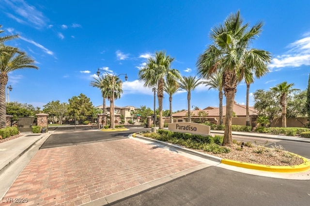 409 Lake Windemere St, Las Vegas, NV 89138 - view of road with street lights, a gated entry, a gate, and curbs