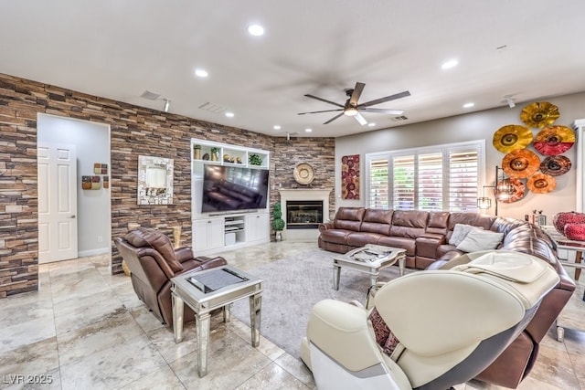 409 Lake Windemere St, Las Vegas, NV 89138 - living area featuring a ceiling fan, a glass covered fireplace, and recessed lighting