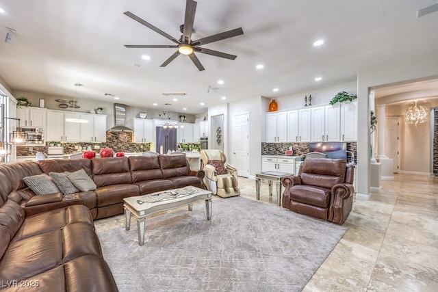 409 Lake Windemere St, Las Vegas, NV 89138 - living room with baseboards, ceiling fan with notable chandelier, and recessed lighting