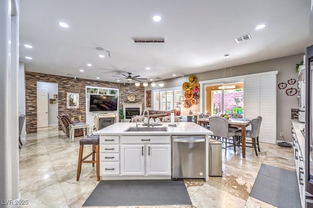409 Lake Windemere St, Las Vegas, NV 89138 - kitchen featuring a sink, a fireplace, white cabinetry, dishwasher, and recessed lighting