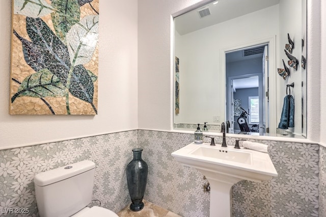 409 Lake Windemere St, Las Vegas, NV 89138 - half bath featuring wainscoting, toilet, a sink, and visible vents