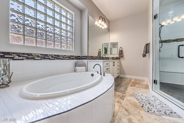 409 Lake Windemere St, Las Vegas, NV 89138 - bathroom with a shower stall, baseboards, vanity, and a bath
