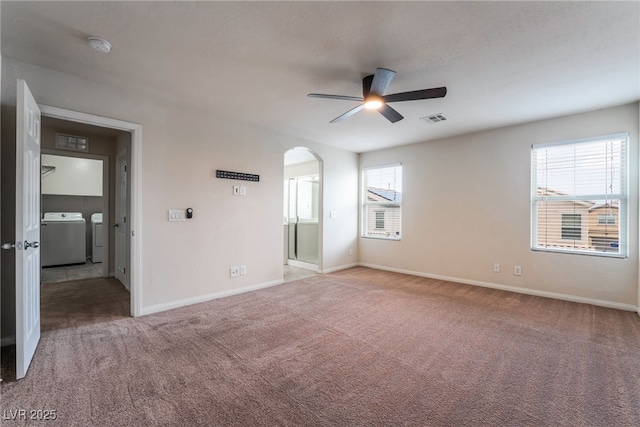 6412 Dimatteo St, Las Vegas, NV 89148 - empty room featuring independent washer and dryer, a ceiling fan, carpet, arched walkways, and a smoke detector
