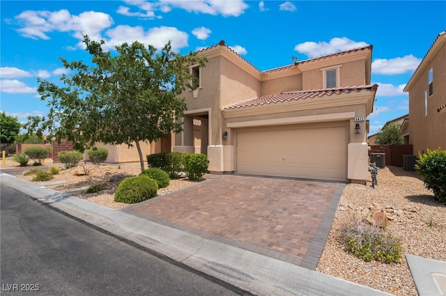 6412 Dimatteo St, Las Vegas, NV 89148 - view of front facade featuring decorative driveway, a garage, a tile roof, and stucco siding