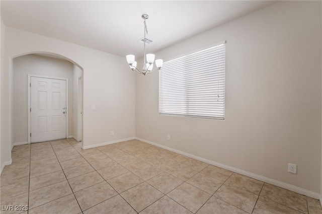 6412 Dimatteo St, Las Vegas, NV 89148 - spare room with arched walkways, a chandelier, and light tile patterned floors
