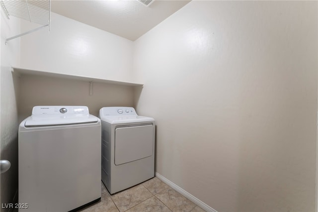 6412 Dimatteo St, Las Vegas, NV 89148 - laundry room with washing machine and clothes dryer and light tile patterned flooring