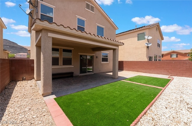 6412 Dimatteo St, Las Vegas, NV 89148 - rear view of house featuring stucco siding, a fenced backyard, and a patio area