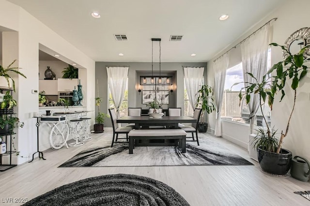 10408 Mezzanino Ct, Las Vegas, NV 89135 - dining space with visible vents, wood finished floors, and recessed lighting