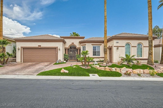 10408 Mezzanino Ct, Las Vegas, NV 89135 - mediterranean / spanish home featuring an attached garage, stucco siding, a tiled roof, and driveway