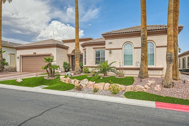 10408 Mezzanino Ct, Las Vegas, NV 89135 - mediterranean / spanish house with a tiled roof, stucco siding, driveway, and a garage