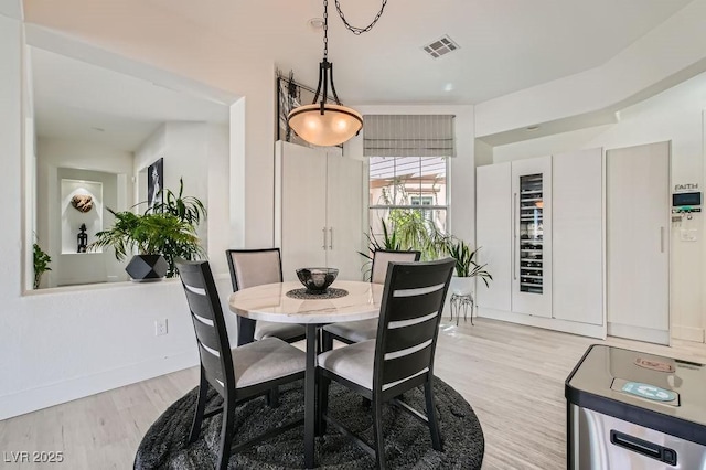 10408 Mezzanino Ct, Las Vegas, NV 89135 - dining room with baseboards, light wood-style floors, and visible vents