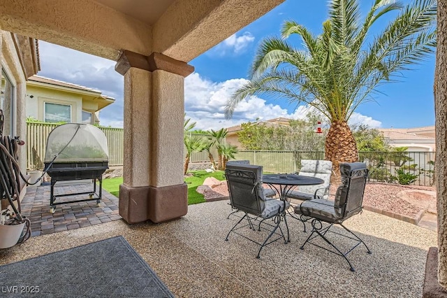 10408 Mezzanino Ct, Las Vegas, NV 89135 - view of patio with a fenced backyard and outdoor dining space