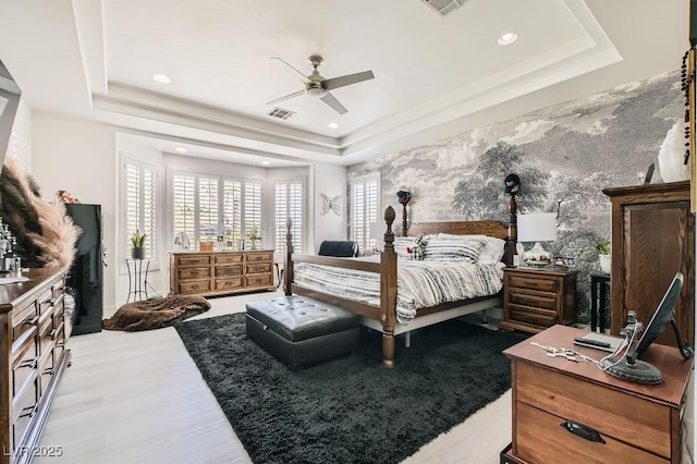 10408 Mezzanino Ct, Las Vegas, NV 89135 - bedroom with visible vents, wood finished floors, a raised ceiling, and recessed lighting