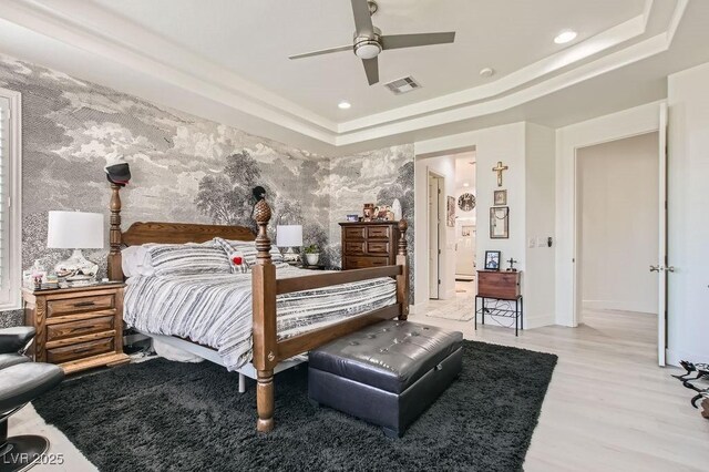 10408 Mezzanino Ct, Las Vegas, NV 89135 - bedroom with a raised ceiling, recessed lighting, visible vents, and wood finished floors