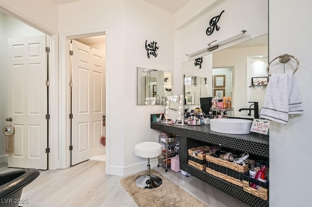 10408 Mezzanino Ct, Las Vegas, NV 89135 - bathroom featuring baseboards, vanity, and wood finished floors