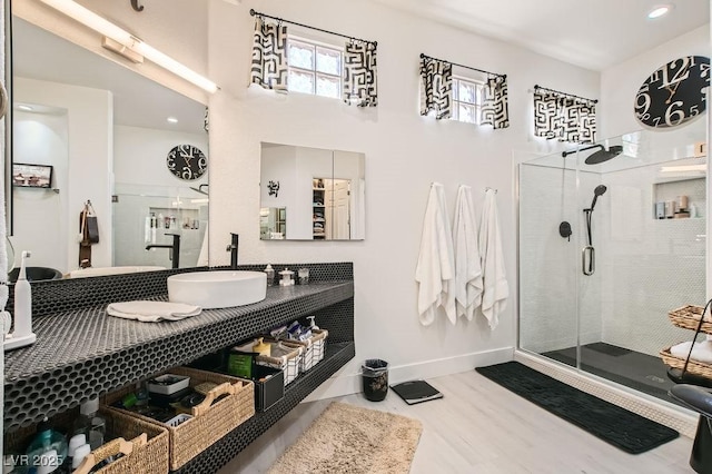 10408 Mezzanino Ct, Las Vegas, NV 89135 - full bathroom with a stall shower, baseboards, and wood finished floors