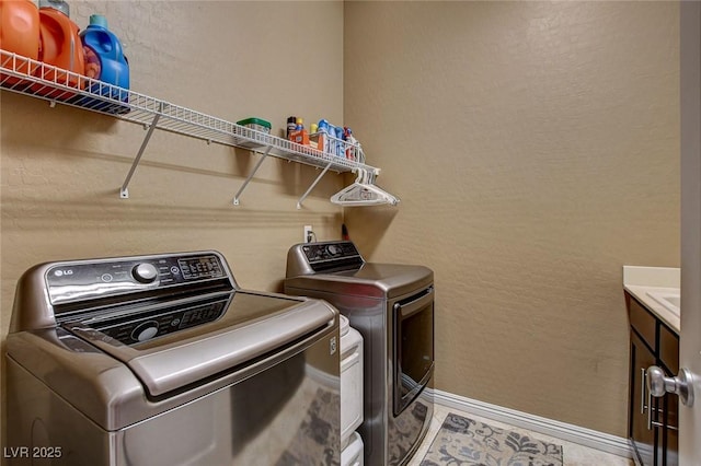 2425 Amatrice St, Henderson, NV 89044 - washroom featuring baseboards, independent washer and dryer, and cabinet space