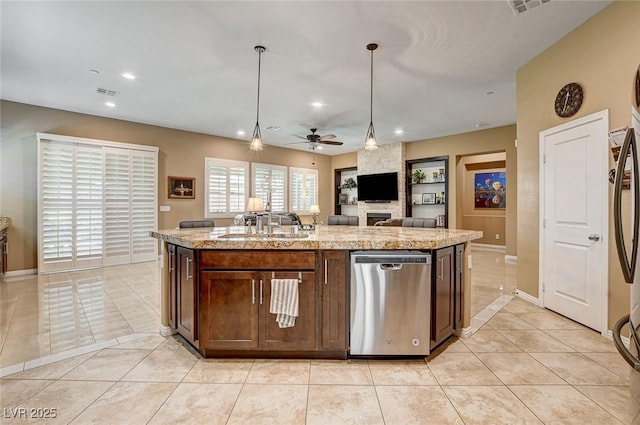 2425 Amatrice St, Henderson, NV 89044 - kitchen with dishwasher, hanging light fixtures, visible vents, ceiling fan, and light tile patterned flooring