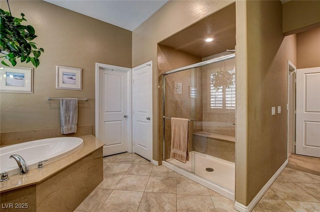2425 Amatrice St, Henderson, NV 89044 - bathroom with a garden tub, a shower stall, baseboards, and tile patterned floors