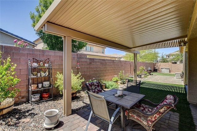 2425 Amatrice St, Henderson, NV 89044 - view of patio with outdoor dining space and a fenced backyard