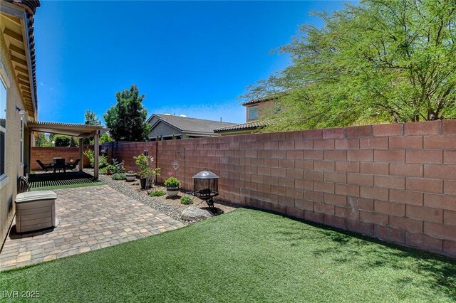 2425 Amatrice St, Henderson, NV 89044 - view of yard featuring a fenced backyard and a patio
