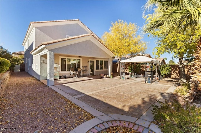 11132 Ferragamo Ct, Las Vegas, NV 89141 - back of house with a gazebo, fence, a patio, and stucco siding
