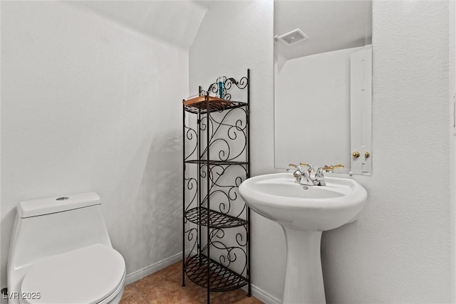 11132 Ferragamo Ct, Las Vegas, NV 89141 - bathroom with a sink, toilet, visible vents, tile patterned flooring, and baseboards