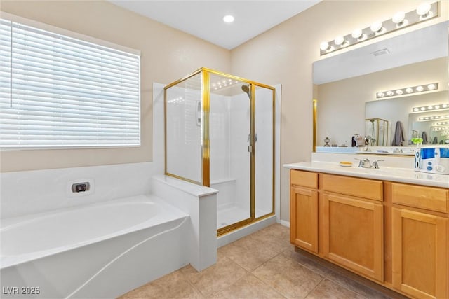 11132 Ferragamo Ct, Las Vegas, NV 89141 - bathroom featuring a shower stall, tile patterned floors, a garden tub, and vanity