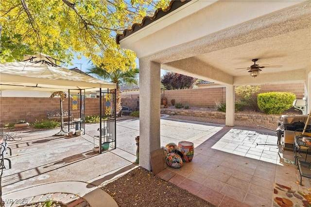 11132 Ferragamo Ct, Las Vegas, NV 89141 - view of patio featuring a gazebo, a ceiling fan, and a fenced backyard