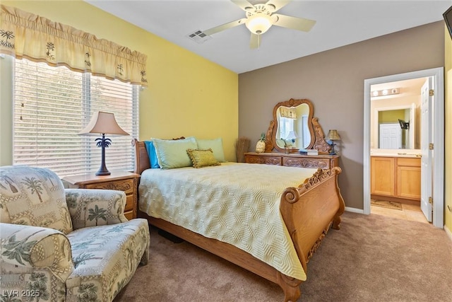 11132 Ferragamo Ct, Las Vegas, NV 89141 - bedroom with light colored carpet, ensuite bathroom, visible vents, and ceiling fan
