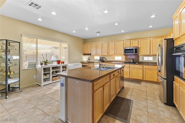 11132 Ferragamo Ct, Las Vegas, NV 89141 - kitchen with a sink, light brown cabinetry, visible vents, and appliances with stainless steel finishes